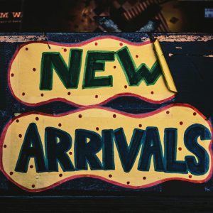 A Vibrant Handmade 'New Arrivals' Sign With Bold Colors, Displayed In A Los Angeles Store.