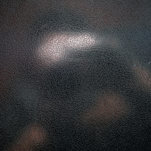 Close Up Of A Textured Black Leather Surface With A Distinct Cracked Pattern, Perfect For Backgrounds.
