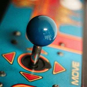 Close Up Of A Vibrant Retro Arcade Joystick Showcasing Vintage Gaming Aesthetics With Colorful Design.