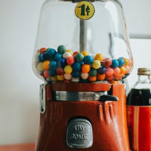 A Retro Gumball Machine Filled With Colorful Gumballs, Evoking Nostalgia.