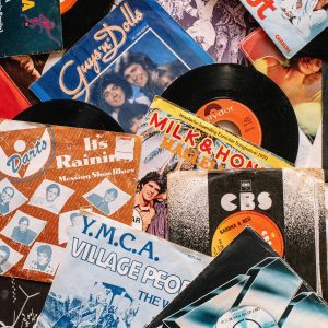 A Flat Lay Of Vintage Vinyl Record Covers Showcasing 70s And 80s Music Nostalgia.