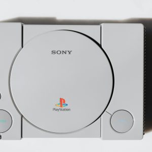 Close Up Of A Classic Sony PlayStation Console On A White Background