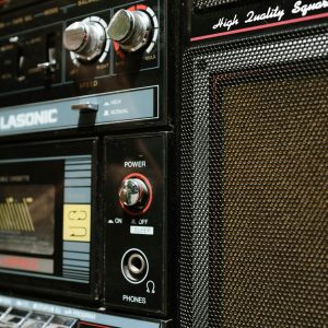 Vintage Boombox Showcasing Classic Design With Close Up On Controls And Speaker.