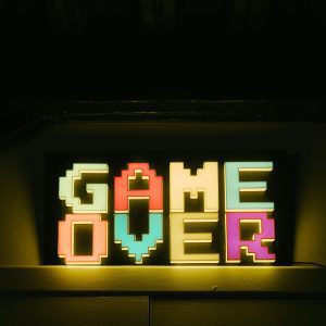 Bright Neon 'Game Over' Sign In Retro Style, Perfect For Gaming Nostalgia