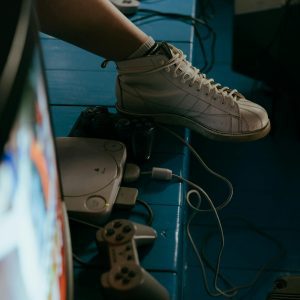 Retro Gaming Setup With Classic Console, Controllers, And TV, Capturing The Nostalgic Vibe.