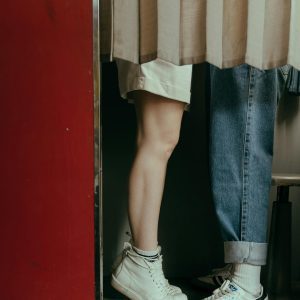 Romantic Moment With Teens In A Vintage Photobooth, Denim And Sneakers Visible.