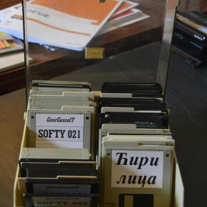 Collection Of Vintage Floppy Disks Stored In A Desk Organizer, Ideal For Nostalgia Themed Projects.