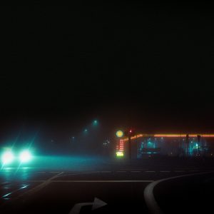A Gas Station Illuminated At Night In Straelen, NRW, Germany With Car Headlights In The Foreground.
