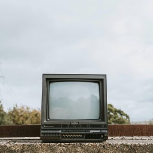 Classic CRT Television Placed Outdoors, Conveying A Nostalgic And Abandoned Vibe.