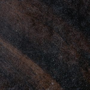 Close Up Of A Dark Textured Surface With Visible Dust, Ideal For Backgrounds Or Design Uses.
