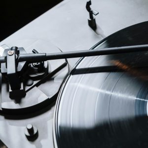 Close Up Of A Vintage Turntable Playing A Vinyl Record, Showcasing Classic Audio Technology.