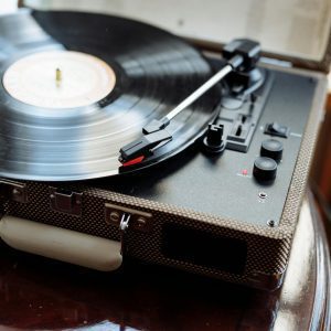 A Close Up Of A Vintage Turntable With A Spinning Vinyl Record, Evoking Nostalgia And Classic Music Vibes.