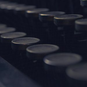 A Moody Close Up Of Vintage Typewriter Keys, Capturing The Nostalgia And History Of Antique Communication Tools.