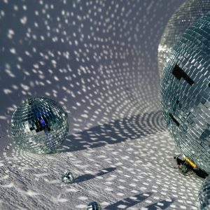 Close Up Of Disco Balls Casting Intricate Reflections, Perfect For Party Themes.