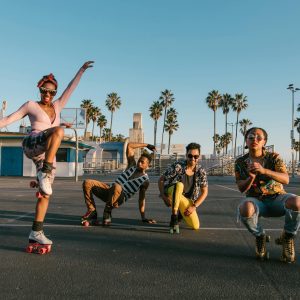 A Lively Group Enjoying Roller Skating Under The Sun At Venice Beach