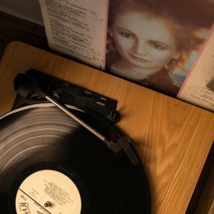 Top View Of A Vintage Turntable Spinning A Vinyl Record, Evoking Nostalgia And Retro Vibes.