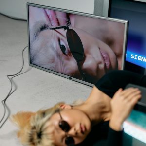 Fashion Model Posing With Vintage Screens In A Studio Setup.