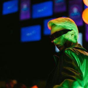 A Stylish Woman In Cyberpunk Attire With Neon Lighting, Embodying A Futuristic Aesthetic.