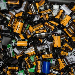 A Vibrant Collection Of Assorted 35mm Camera Film Rolls Showcasing The Nostalgia Of Analog Photography.