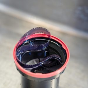 A Close Up View Of Photographic Film In A Development Tank, Showcasing Film Processing.