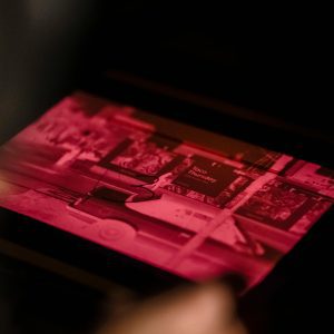 Close Up Of A Film Negative Being Processed In A Darkroom With An Enlarger.