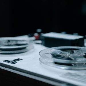 Detailed View Of A Vintage Reel To Reel Tape Recorder Showcasing Classic Design And Equipment.