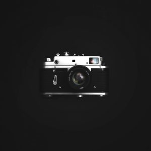 Classic Film Camera With A Vintage Look On A Dark Background, Showcasing Photography Nostalgia.