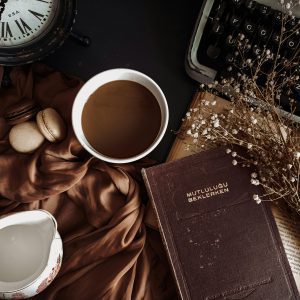 Aesthetic Flat Lay With Coffee, Book, Typewriter, And Rustic Elements Creating A Vintage Atmosphere.