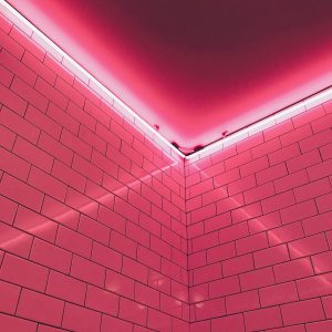 Aesthetic Neon Lit Pink Tiled Corner Creating A Modern And Vibrant Atmosphere.
