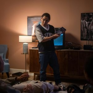 Friends Relaxing Indoors For A Nostalgic Movie Night, Enjoying Old VHS Tapes.