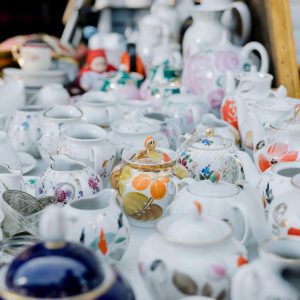 A Vibrant Collection Of Assorted Porcelain Teapots On Display, Showcasing Intricate Patterns And Designs.